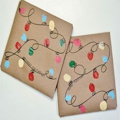 two brown paper plates with christmas lights on them