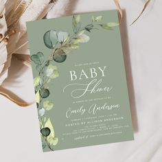 a baby shower with eucalyptus leaves and greenery