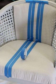 a white chair with blue stripes on it