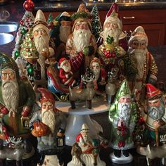 a group of christmas figurines sitting on top of a table