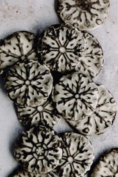 several cookies with black and white designs on them