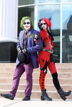 two people dressed up as the joker and harley in front of a building with stairs