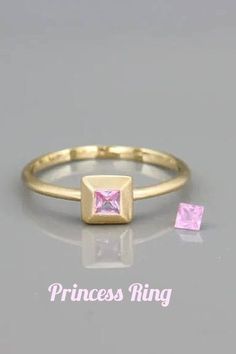 Bridal Princess ring, Pink Sapphire Ring, Solid 14k gold ring set with princess cut pink sapphire, Square sapphire ring. This ring is a dainty yet gorgeous pink sapphire ring. The ring was designed so the bezel looks like a crown for the stone extending it and enhancing its natural beauty. You can wear the ring on its own or to stack it with other rings from my collection. This ring will add a stylish luxury touch to your look. Pink 14k Gold Stackable Ruby Ring, Stackable Pink Ruby Ring In 14k Gold, Pink Gemstone Stackable Rings In 14k Gold, Gold Pink Sapphire Stackable Rings For Gift, 14k Gold Stackable Princess Cut Rings For Gift, Gold Stackable Rings With Pink Sapphire As A Gift, Gold Stackable Rings With Pink Sapphire For Gift, Emerald Cut Pink Sapphire Ring Gift, Yellow Gold Princess Cut Sapphire Ring