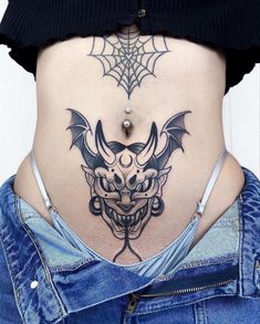 a woman with a tattoo on her stomach