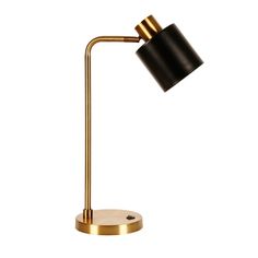 a black and gold desk lamp on a white background, with the light turned off