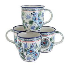 three coffee cups with blue flowers on them