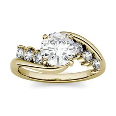 a yellow gold engagement ring with diamonds on it