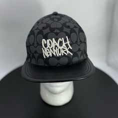 New Condition. Never Worn. Leather Brim. Leather Strap Designer Black Hat For Streetwear, Modern Black Hat With Flat Brim, Modern Black Streetwear Hat, Modern Black Snapback Hat, Coach New York, Coach Accessories, Black Gray, Leather Straps, Accessories Hats