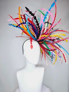 From the 2024 Featured Milliner of the Kentucky Derby Museum  Gorgeous Kentucky Derby hat fascinator  kentucky derby hat fascinator rainbow huge blue red yellow green pink orange black zigzag feather headpiece  huge impact but light as a feather! super comfy! headband attachment.  each hat is totally one of a kind! no two are alike! I can probably add feathers, flowers etc to existing hats for a small fee. I cannot remove anything from existing hats. Just message me and see if we can make it wor Ostrich Feather Headpiece, Kentucky Derby Hats Diy Funny, Crazy Hat Ideas, Crazy Kentucky Derby Hats, Paper Headpiece, Kentucky Derby Fascinator, Derby Hats Fascinators, Pink Fascinator, Headpiece Diy