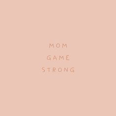 the words mom game strong are shown against a pale pink background with an orange rectangle