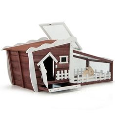 a wooden toy house with a dog in it's kennel and its door open