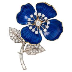 This perfectly-posed blue enamel flower pin has a diamond stamen, stem and leaves. The blue enamel petals contrast beautifully with the liveliness of the diamonds. The flower head is tilted slightly to make the form look natural. 51 full-cut diamonds weighing a total of approximately 2.15 carats 7 baguette-cut diamonds weighing a total of approximately 0.85 carats Diamonds are H-I color/VS clarity Length 2 ¼” Width of flower head 1 ½” Mounted in 18k yellow gold and platinum Signed Boucheron with Eglantine Rose, Hope Diamond, Golden Crown, Security Companies, Diamond Brooch, Stone Setting, Enamel Flower, Fabulous Jewelry, Floral Jewellery