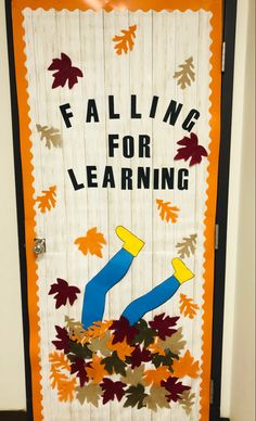 a door decorated with fall leaves and the words falling for learning