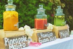 three jars filled with liquid sitting on top of a table