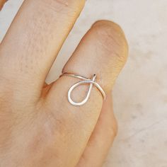 Delicate details make our Initial Ring in Silver a gorgeous addition to your finger! This beautiful piece is slim and trim, with a sweet cursive letter that lets you express yourself and to wear one on top of the other that make your look even more intriguing. This unique ring is made with gorgeous Sterling Silver for a beautiful shine that lasts. • Material: High Quality Sterling Silver 925, Gold Filled 12k, Rose Gold 12k• This ring is adjustable (you will receive it in the standard size US7, i Simple Adjustable Initial Ring, J Ring, Personalized Initial Ring, Lowercase Letter, Cursive Letters, Letter Ring, Initial Ring, Letter J, Unique Ring