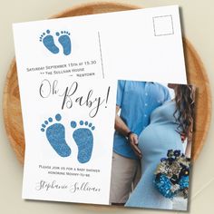 a baby announcement card with blue footprints on it next to a photo of a pregnant woman