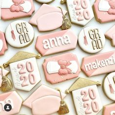 decorated cookies with pink and white graduation decorations