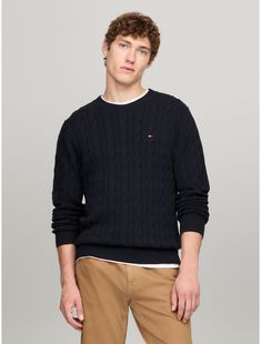 Tommy Hilfiger men's sweater. Made from soft cotton in a textured cable knit weave, this crewneck sweater is the perfect transitional-weather layer, complete with rib-knit cuffs, collar and hem with touches of subtle branding throughout.  Material: Body Length From High Point Of Shoulder: 27.5".. Tommy Hilfiger Sweater Men, Tommy Sweater, Tommy Hilfiger Sweater, Knit Crewneck, Tommy Hilfiger Man, Mens Crew Neck, High Point, Knit Cuff, Crewneck Sweater