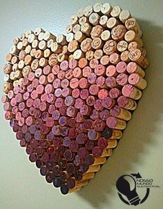 a heart made out of wine corks on a wall