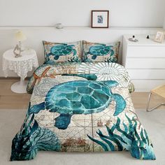 a bed in a room with a sea turtle on it's cover and pillows