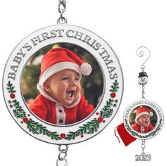 a baby's first christmas ornament and keychain with a photo on it