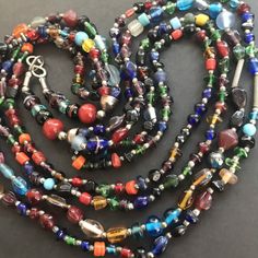 ON SALE Very nice huge statement for Strand long glass beaded statement necklace in very good vintage condition. Measures 30 inches long. Perfect for any outfit, collection and sure to become a favorite. Vintage Multicolor Multi-strand Beads, Vintage Glass Beaded Necklaces With Colorful Beads, Multicolor Round Beads Necklace For Party, Bohemian Glass Beaded Necklaces For Party, Multicolor Bohemian Long Necklace With Polished Beads, Vintage Multicolor Long Necklace, Multicolor Multi-strand Glass Beaded Necklaces, Multicolor Multi-strand Glass Beads, Multicolor Glass Beaded Long Necklace