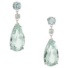 Soft bright greenish blue natural untreated aqua and diamond dangle earrings. Two pear shaped 18.42ct. aquamarine dangles with 2 round aqua's and 2 round mine cut diamonds in 18k white gold settings. The stones are from the 1950's and the earrings are Designed and crafted in the Peter Suchy workshop 2 pear shaped blue aquamarine, VS approx. 18.42cts 2 round cut blue aquamarines, VS approx. 1.71cts 2 round mine cut diamonds, I-J SI approx. .48cts 18k white gold Stamped: 18k 8.4 grams Top to botto Luxury Silver Aquamarine Earrings, Aquamarine Earrings Vintage, Mesh Necklace, Platinum Rose Gold, Aquamarine Earrings, Gold Dangle Earrings, Purple Sapphire, Diamond Dangle Earrings, Gold Bracelet Cuff