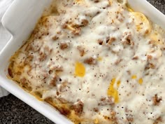 a casserole dish with cheese and meat in it