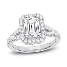 an emerald cut diamond engagement ring with double halos