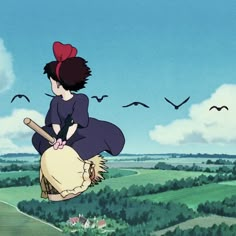 a woman flying through the air on top of a bag with birds in the background