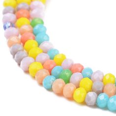 a multicolored beaded necklace on a white background