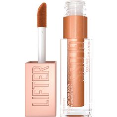 the lip gloss is next to an empty tube