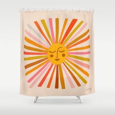 a shower curtain with an image of a sun on it