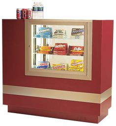 a red and gold vending machine with sodas in it's display case