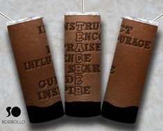 three brown paper cups with writing on them