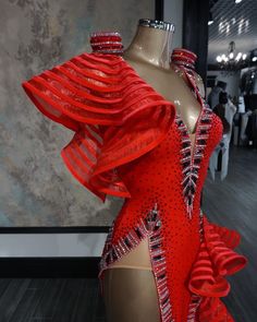 a red dress on display in a store