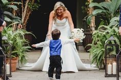 a little boy and his mother walking down the aisle