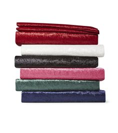 four colors of velvet sheets stacked on top of each other in different sizes and shapes