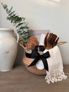 a basket filled with items sitting on top of a table next to a potted plant