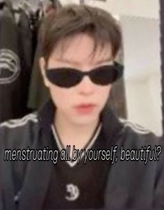 a man wearing sunglasses with the words menstructing all by yourself beautiful?