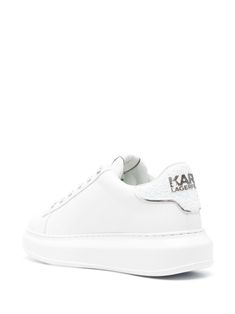 Find KARL LAGERFELD Kapri Leather Platform Sneakers on Editorialist. white/silver-tone calf leather smooth grain iridescent effect logo lettering to the side crystal embellishment to the logo sequin detailing to the rear embossed logo to the side logo print to the rear logo patch at the tongue logo at the sole round toe front lace-up fastening branded leather insole platform sole rubber outsole White Leather Sneakers With Foil Embossed Logo, Tone Calves, Crystal Embellishment, Platform Sneakers, Embossed Logo, Sneakers White, White Silver, Karl Lagerfeld, Logo Print