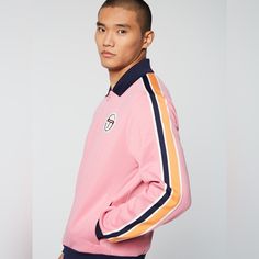 An Elevated Take On Retro Sportswear, The Monte Track Jacket Is Made Of Performance Poly-Cotton And Features Our Iconic 'St' Monogram Logo In An Embroidered Patch With Terry Towel Detailing At The Left Chest. Part Of Our Archivio Collectioncelebrating Classic Designs From The Archivethis Full-Zip Jacket Is Complete With Multicolored Striped Taping Down The Sleeves. Pair With The Monte Track Pant Archivio For The Full Fit. Sold As Set. Premium Track Jacket 60/40 Poly-Cotton Double Face Knit Full- Pink Long Sleeve Track Jacket For Spring, Sporty Pink Collared Top, Pink Long Sleeve Outerwear With Ribbed Cuffs, Pink Sporty Collared Top, Spring Pink Long Sleeve Track Jacket, St Monogram, Retro Sportswear, Sergio Tacchini, Track Suit