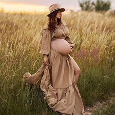 Camel maternity dress for photo session :  - two piece bohemian style gown - ruffled off the shoulder long sleeve crop top  - long maxi skirt with ruffle , it is longer in the back, the skirt has slits on both sides and adjustable waist  This gorgeous boho set is made of very soft, natural gauze material ( 100% cotton ).  All materials used are new and sewed by me. The material is certified by OEKO_TEX Standard 100 and GOTS - meeting all safety standards. SIZE : One size fits most  ( S- XL )  COLOR : TAN /camel Color / Colors on your monitor may differ slightly from the original. PRODUCT CARE: Hand washing or machine wash on gentle mode in lukewarm water and air-drying for best care, iron on medium to high heat, do not machine dry! SHIPPING : Standard shipping with UPS  or other depending Bohemian Style Gown, Bohemian Gown, Long Maxi Skirt, Off The Shoulder Long Sleeve, Long Crop Top, Long Maxi Skirts, Maternity Shoot, Soft Natural, Camel Color