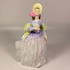 This Royal Doulton figurine is a beautiful addition to any collection. Crafted in England in 1979, this figurine features the brand's signature attention to detail. The piece is in great shape and ready to display in any decorative setting. The figurine is part of the Royal Doulton collection and is categorized under Sculptures & Figurines, Decorative Collectibles, and Collectibles. Its HN number is 2793, making it a unique and sought-after item. Add this exquisite piece to your collection today. Approximate Dimensions: 7 3/4 " inches Height Condition   :  Absolutely no chips or cracks and has not been restored . Item is in good preowned condition.  Please note that our items are most often vintage or antique, sometimes many decades or even a century old, so they will show some signs of we Rare Royal Doulton Figurines, Vintage Glassware, Royal Doulton, Collectible Figurines, Vintage Antiques, Art Collection, Figurines, Bathing Beauties, England