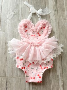 Baby romper great for cake smash sessions! Awesome birthday photo prop.  cherry themed!  Handmade  All sales final Halter top Stretchy  Pink, red and white This listing is for romper ONLY headbands to match now listed in my shop!  you need to add headband to your cart. https://spoonfuloffreckles.etsy.com/listing/1718582254 check out Maddie's little bracelets she is making listing in my Etsy shop. this listing is for romper only  cherry first birthday Cute Pink Bubble Romper For Birthday, Sweet Pink Bubble Romper For Birthday, Pink Bubble Romper For Summer Birthday, Cute Pink Bubble Romper For First Birthday, Pink Sleeveless Bubble Romper For First Birthday, Cute Pink Bubble Romper For Cake Smash, Pink Ruffled Bubble Romper For First Birthday, Ruffled Bubble Romper For First Birthday In Summer, Spring Bubble Romper With Ruffles For First Birthday