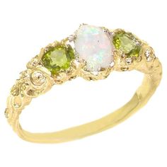 This Delightful ring has been hand set with one colorful Opal & two Peridots. The Opal measures 6x4mm oval and the Peridots are 4mm round. They have been hand set in to this beautiful Trilogy ring of English Victorian Design, comfortable and easy to wear. These are Genuine Natural Opal & Peridots. The colors in the Opal are enhanced by the contrasting bright olive green color of the Peridots. Being Natural each gemstone is unique and will have slight variances therefore the gemstones for this ri Peridot Wedding Ring, Promise Rings For Girlfriend, Yellow Gold Diamond Wedding Band, Promise Rings For Guys, Trilogy Ring, Yellow Gold Diamond Ring, Victorian Design, Bridesmaid Jewelry Sets, Peridot Ring