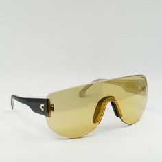 Introducing the Carrera FLAGLAB 12 04CW ET Yellow Black/Yellow Gold Mirror sunglasses from OSSA FRAMES - the perfect blend of style and sophistication for the modern woman. Crafted with precision and expertise, these striking shield frames boast a unique Frame Color of Yellow Black that adds a pop of color to any ensemble. The Lens Color of Yellow Gold Mirror not only offers a fashionable touch but also provides superior protection against harmful UV rays. With a Lens Socket Width of 99, these sunglasses offer a comfortable and snug fit for all-day wear. The sleek and elegant design of the Carrera FLAGLAB 12 04CW ET sunglasses is complemented by the metal Frame Material, which ensures durability and longevity. The Temple Length of 140 and Bridge Size of 1 provide added comfort and stabilit Modern Yellow Tinted Shield Sunglasses, Yellow Frame Sunglasses, Black Frame Yellow Lens Sunglasses, Luxury Yellow Tinted Sunglasses, Yellow Rectangular Sunglasses With Gradient Lenses, Anthony Anderson, Shapes For Kids, Anna Dello Russo, Jennifer Hudson