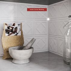 a bag and bowl sit on the counter in front of a wall with white tiles