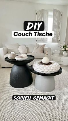 a living room with couches and tables in it