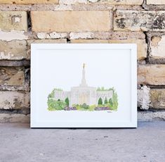 a watercolor painting of the state capitol building in washington, d c is displayed against a brick wall